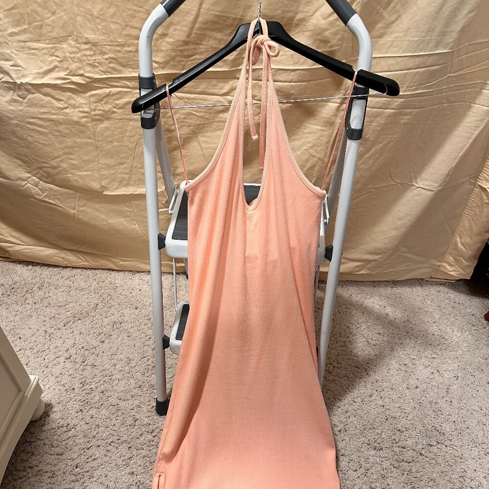 Orange midi dress, straps for shoulders to be tied back around neck, open legs